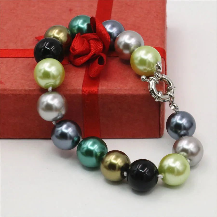 Set of necklace and bracelet with round cone-shaped beads, featuring a stylish design from Corporación Turística.