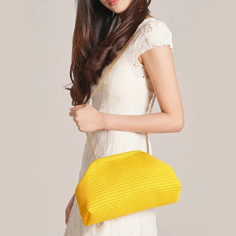 Yellow women's beach clutch bag with a smooth, solid color design, perfect for casual summer outings.