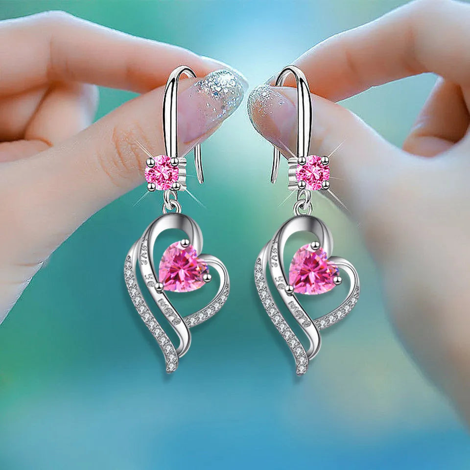 Yellow Korean heart-shaped drop earrings for women, stylish jewelry by Corporación Turística, hanging design with a glossy finish.
