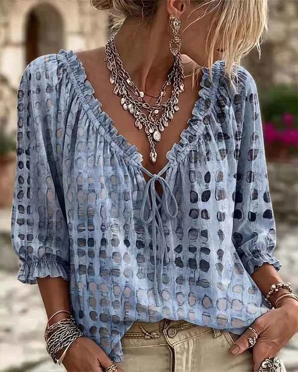 Bohemia summer women's blouse by Corporación Turística with loose fit, floral print, and V-neck design.