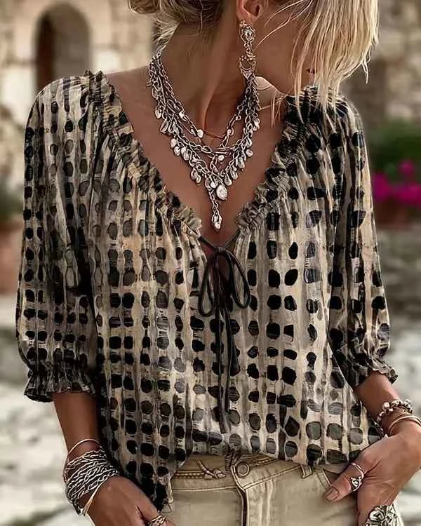 Bohemia-style summer women's blouse with loose fit, floral print, and V-neck, by Corporación Turística.
