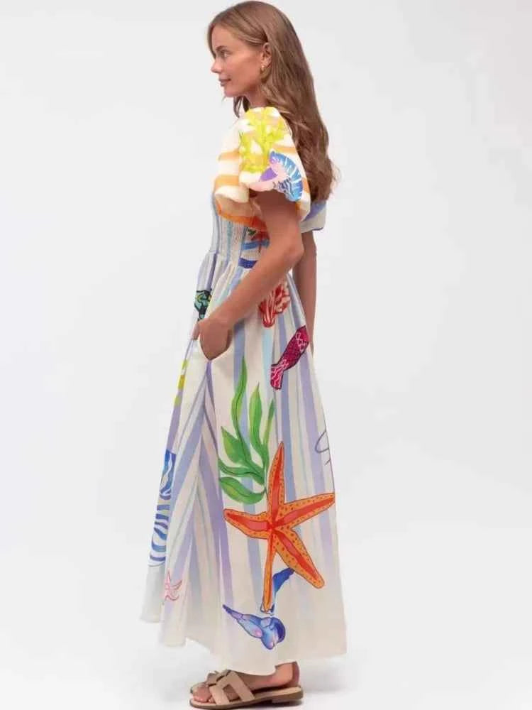 Fansumgo maxi beach dress with colorful mixed print, lightweight bata style, perfect for summer and beach outings.