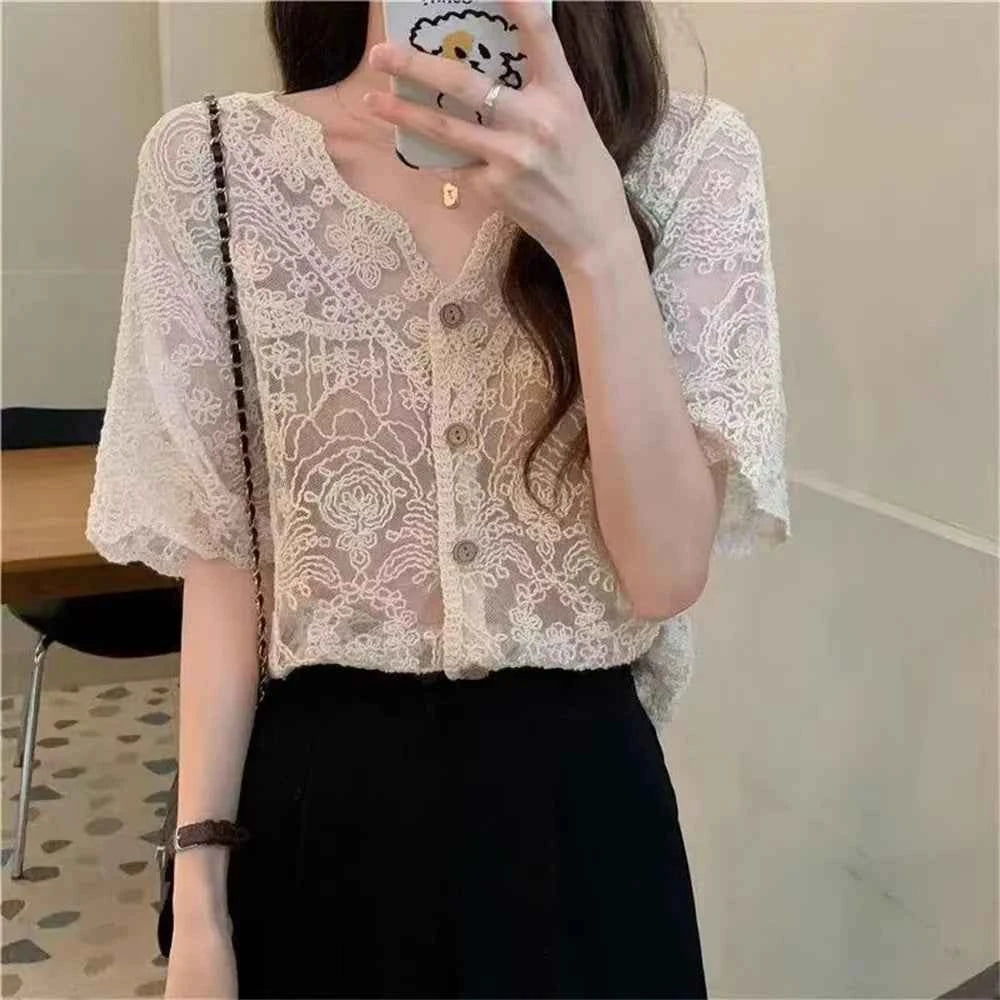 White flubiflous lace cardigan with long sleeves, lightweight design, perfect for spring-summer casual or elegant wear.