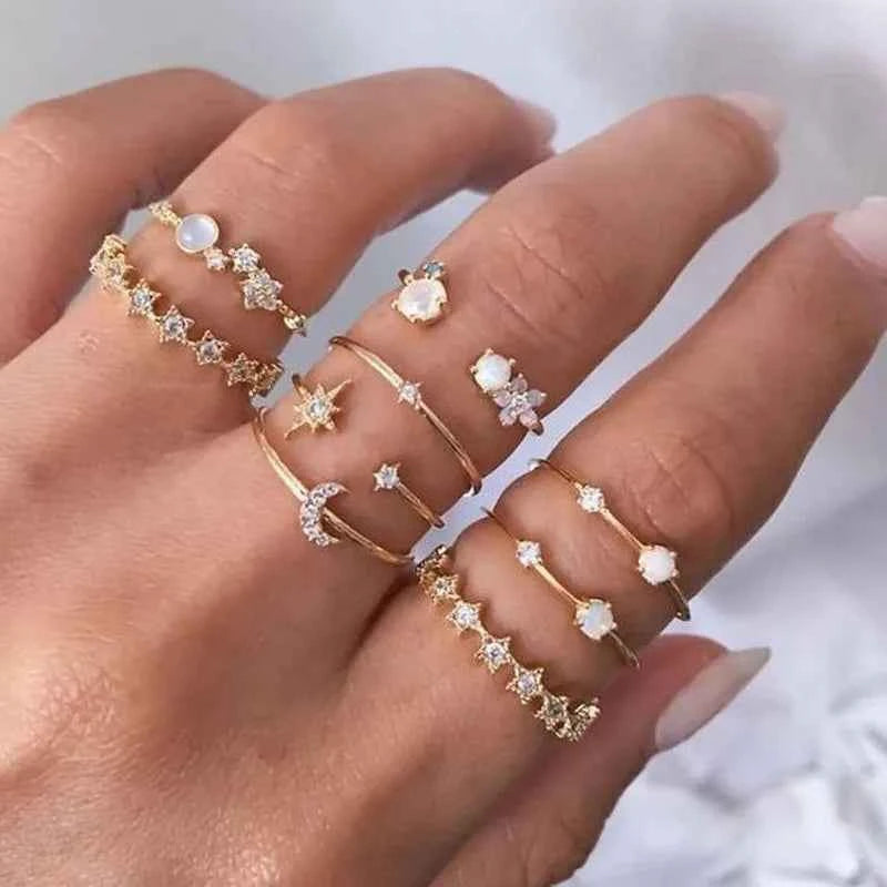Modyle 18K gold bohemian wedding ring set with circon stones, featuring multiple rings with intricate designs for women.