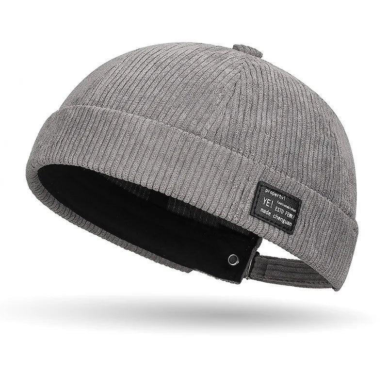 Unisex Yuppie fleece-lined corduroy beanie hat with colorful stripe pattern for fall and winter warmth.