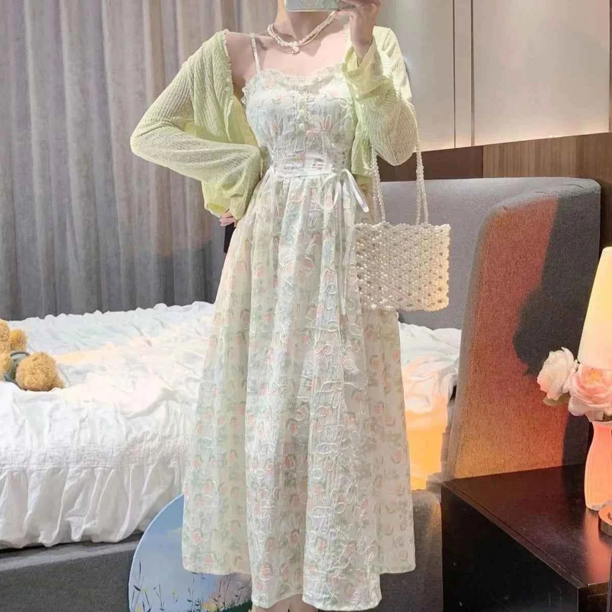 Oyao floral summer 2026 two-piece set with fitted dress and cardigan, perfect for warm weather fashion, in vibrant floral print.