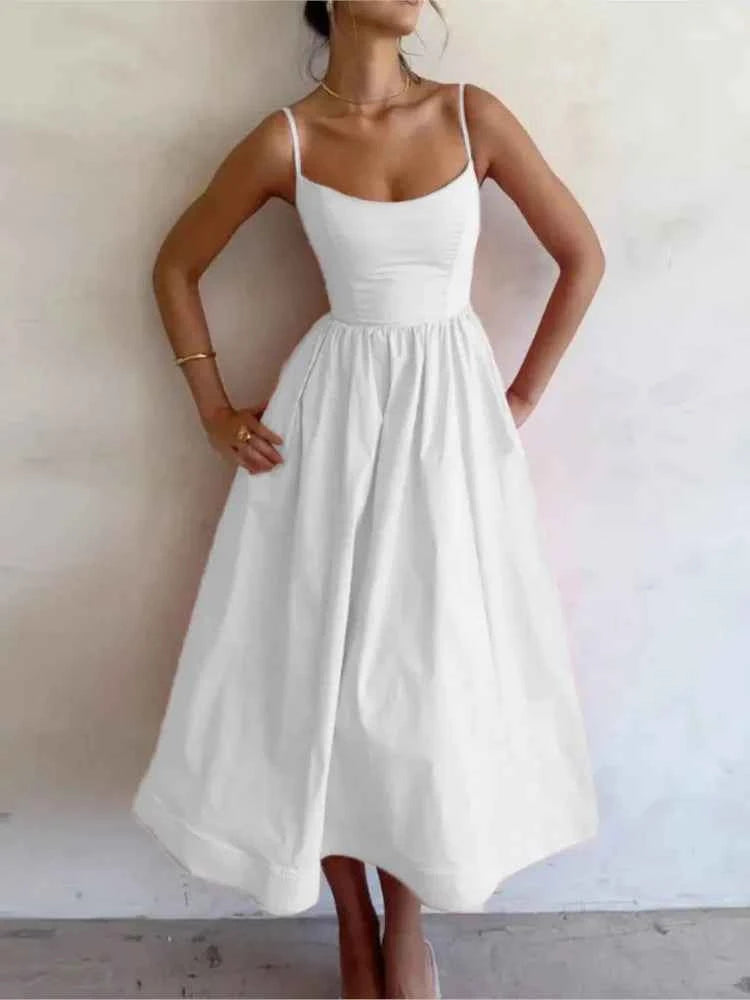 Elegant pink midi dress for women with thin straps and A-line silhouette, ideal for vacations and summer occasions.