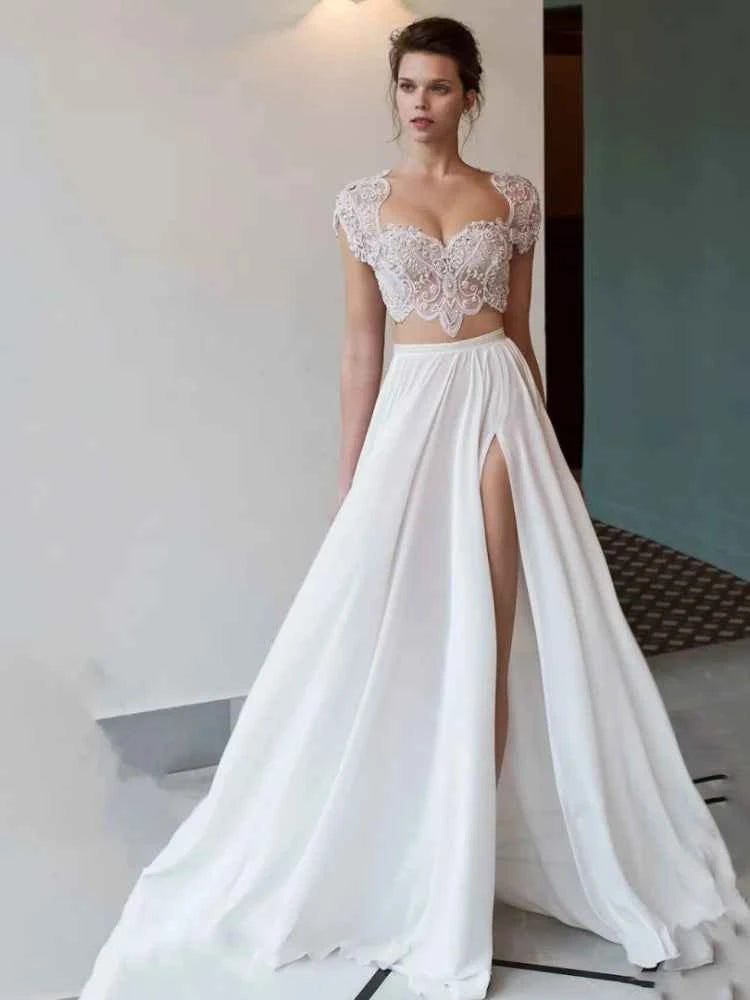 Bohemian bridal wedding dress by ZHUISHU with white flowing fabric, heart-shaped neckline, and front slit for a romantic look.